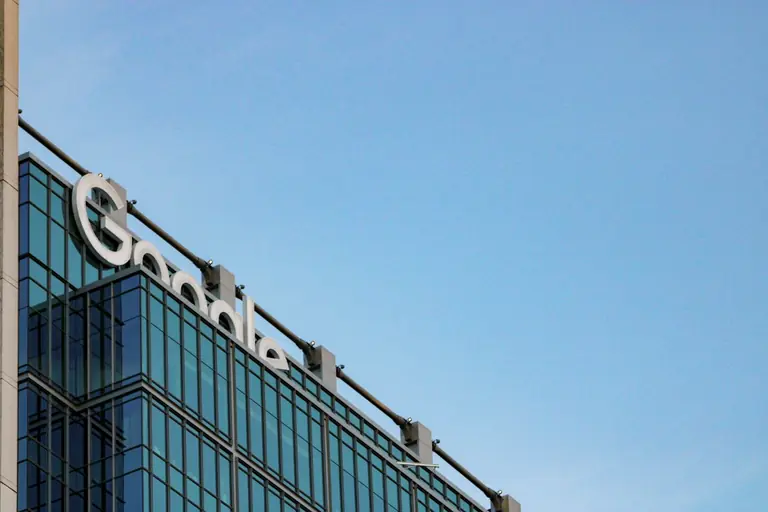 a tall building with a sign on top of it