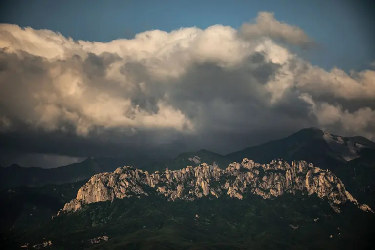 Majestic Seoraksan mountains with dramatic cloudscape, showcasing stunning natural beauty in South Korea.