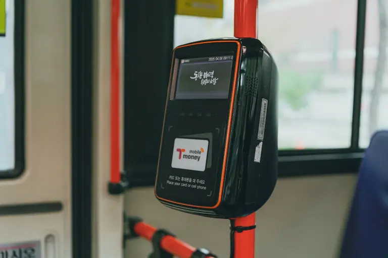 Close-up of a public transportation payment machine inside a bus in Seoul, South Korea.